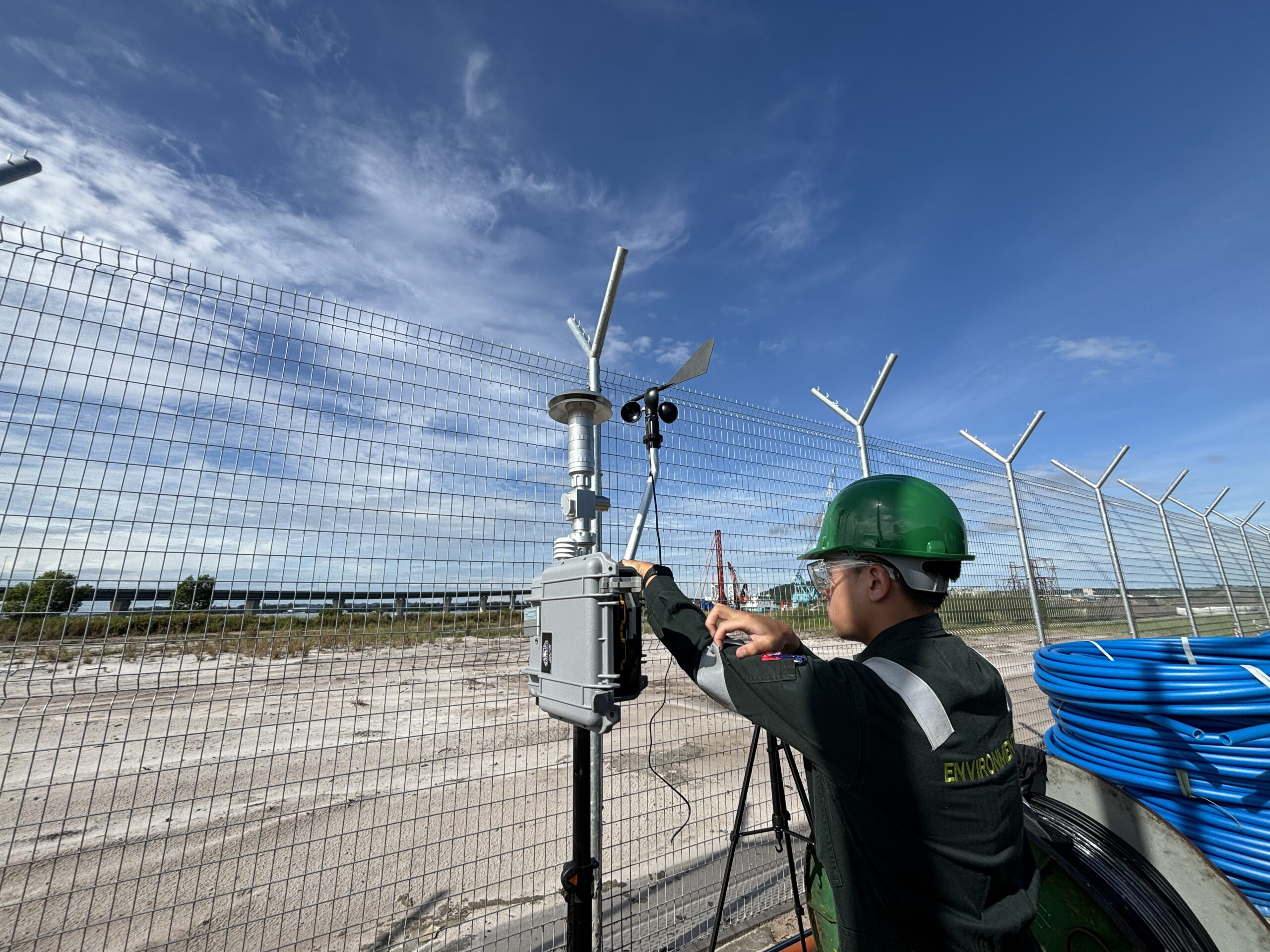 PPI personnel operating air monitoring equipment