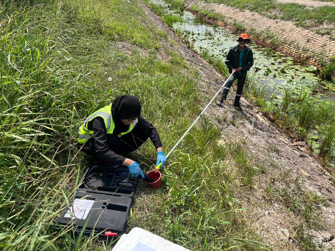 PPI personnel undertaking environmental monitoring near a waterway